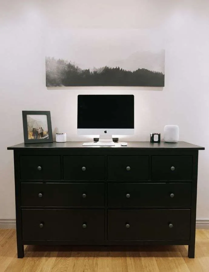 dresser used as a tv stand in small apartment