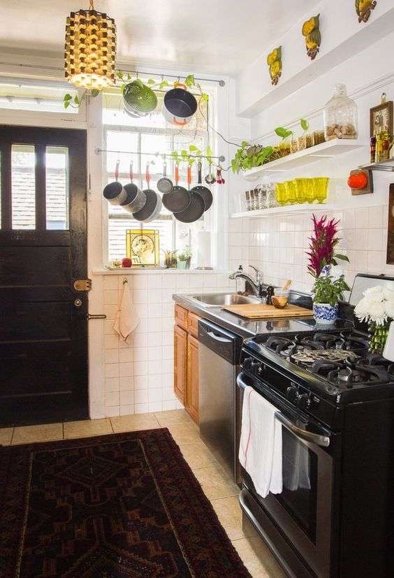 store pots and pans in a small kitchen over the kitchen window